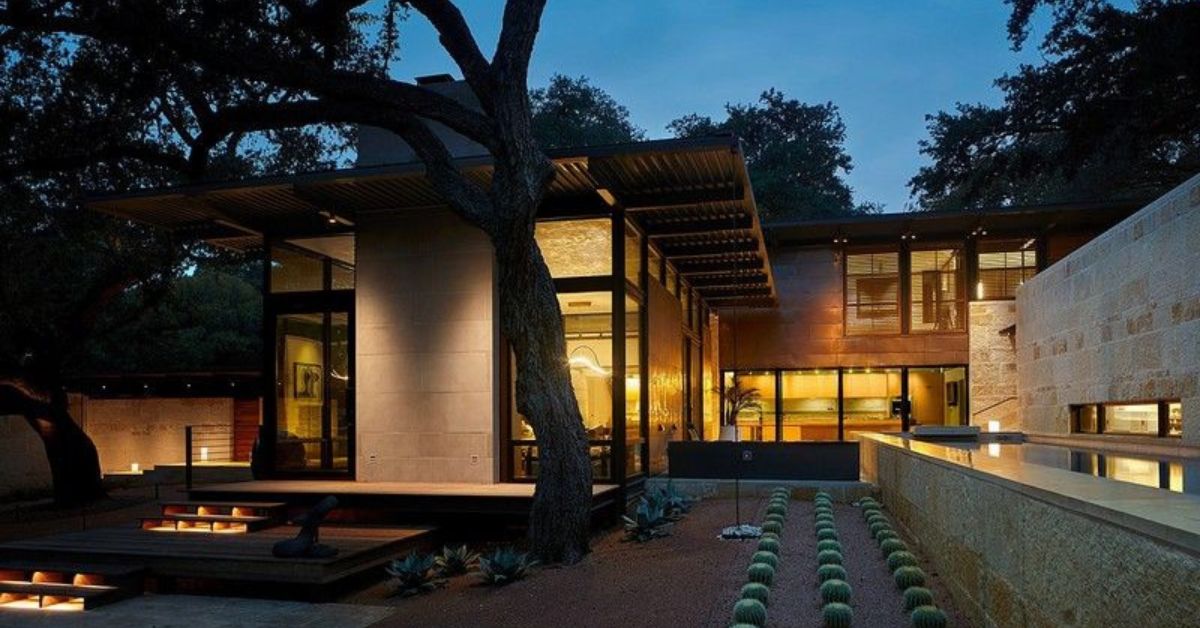 A modern home with a fire pit and trees in the best neighborhood in San Antonio, Olmos Park.