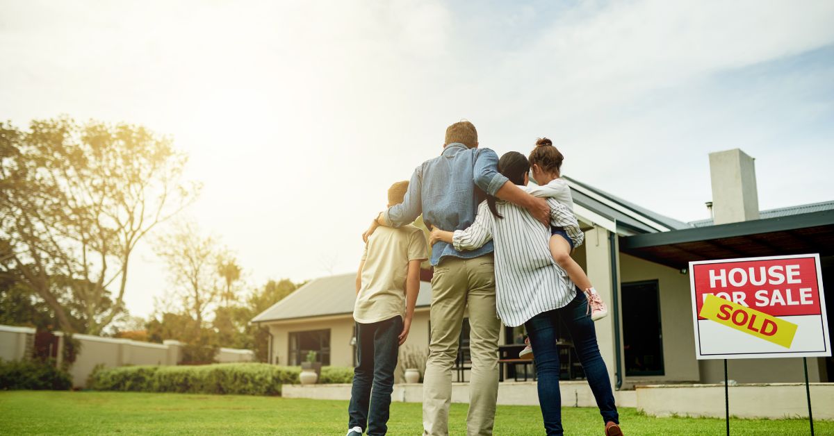 A family standing in front of a house in a safe neighborhood in San Antonio, Texas.